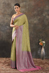 Shop beautiful green georgette saree online in USA with antique zari pink border. Be vision of elegance on special occasions in exquisite designer sarees, handwoven sarees, georgette sarees, embroidered sarees, Banarasi sarees from Pure Elegance Indian saree store in USA.-full view