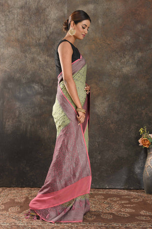 Buy stunning pastel green georgette saree online in USA with antique zari pink border. Be vision of elegance on special occasions in exquisite designer sarees, handwoven sarees, georgette sarees, embroidered sarees, Banarasi sarees from Pure Elegance Indian saree store in USA.-side