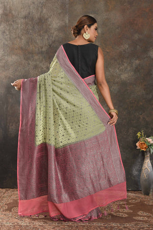 Buy stunning pastel green georgette saree online in USA with antique zari pink border. Be vision of elegance on special occasions in exquisite designer sarees, handwoven sarees, georgette sarees, embroidered sarees, Banarasi sarees from Pure Elegance Indian saree store in USA.-back