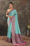 Buy beautiful light blue georgette sari online in USA with antique zari pink border. Be vision of elegance on special occasions in exquisite designer sarees, handwoven sarees, georgette sarees, embroidered sarees, Banarasi sarees from Pure Elegance Indian saree store in USA.-full view