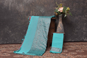 Shop gorgeous pink georgette sari online in USA with antique zari sea green border. Be vision of elegance on special occasions in exquisite designer sarees, handwoven sarees, georgette sarees, embroidered sarees, Banarasi sarees from Pure Elegance Indian saree store in USA.-blouse