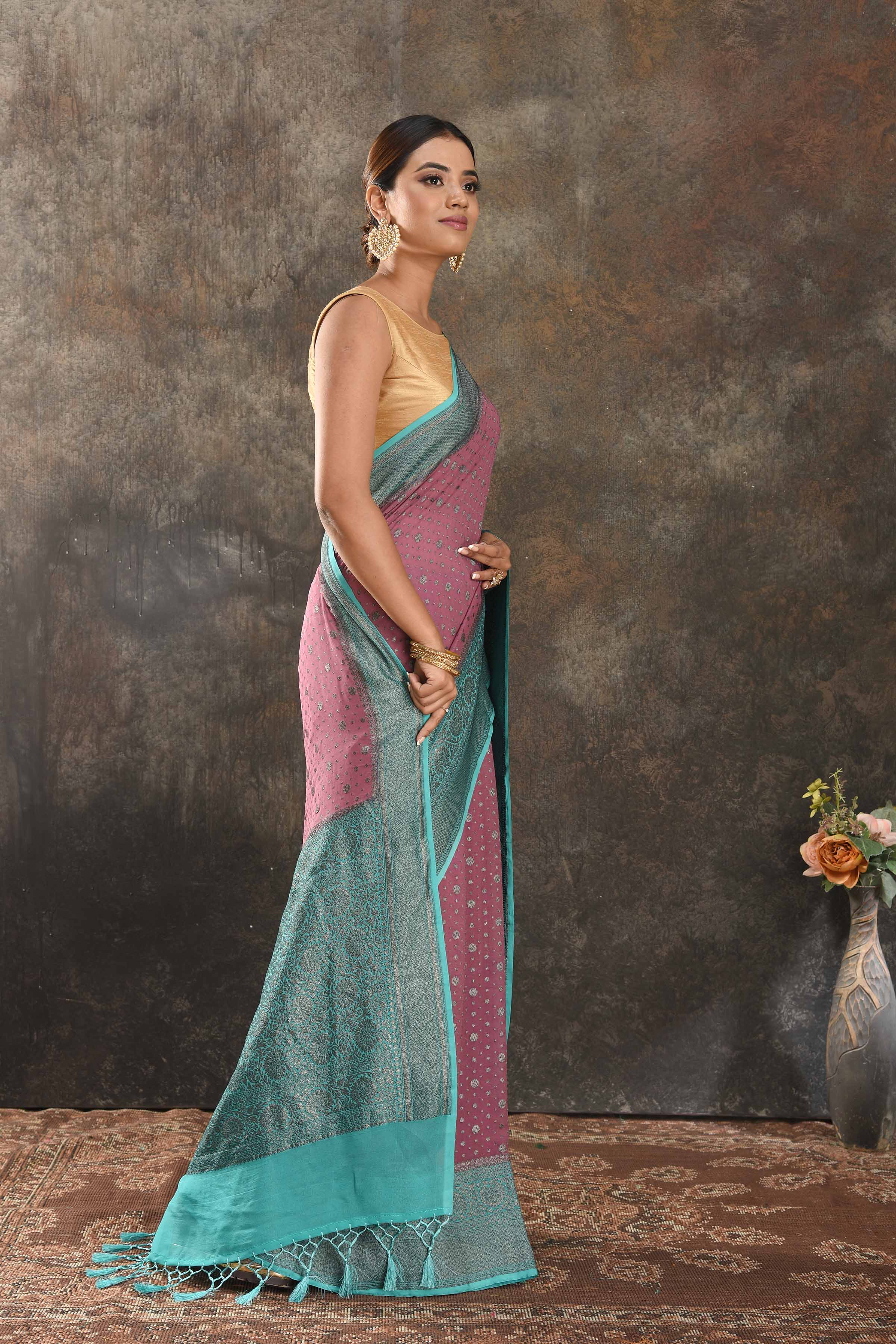 Shop gorgeous pink georgette sari online in USA with antique zari sea green border. Be vision of elegance on special occasions in exquisite designer sarees, handwoven sarees, georgette sarees, embroidered sarees, Banarasi sarees from Pure Elegance Indian saree store in USA.-side