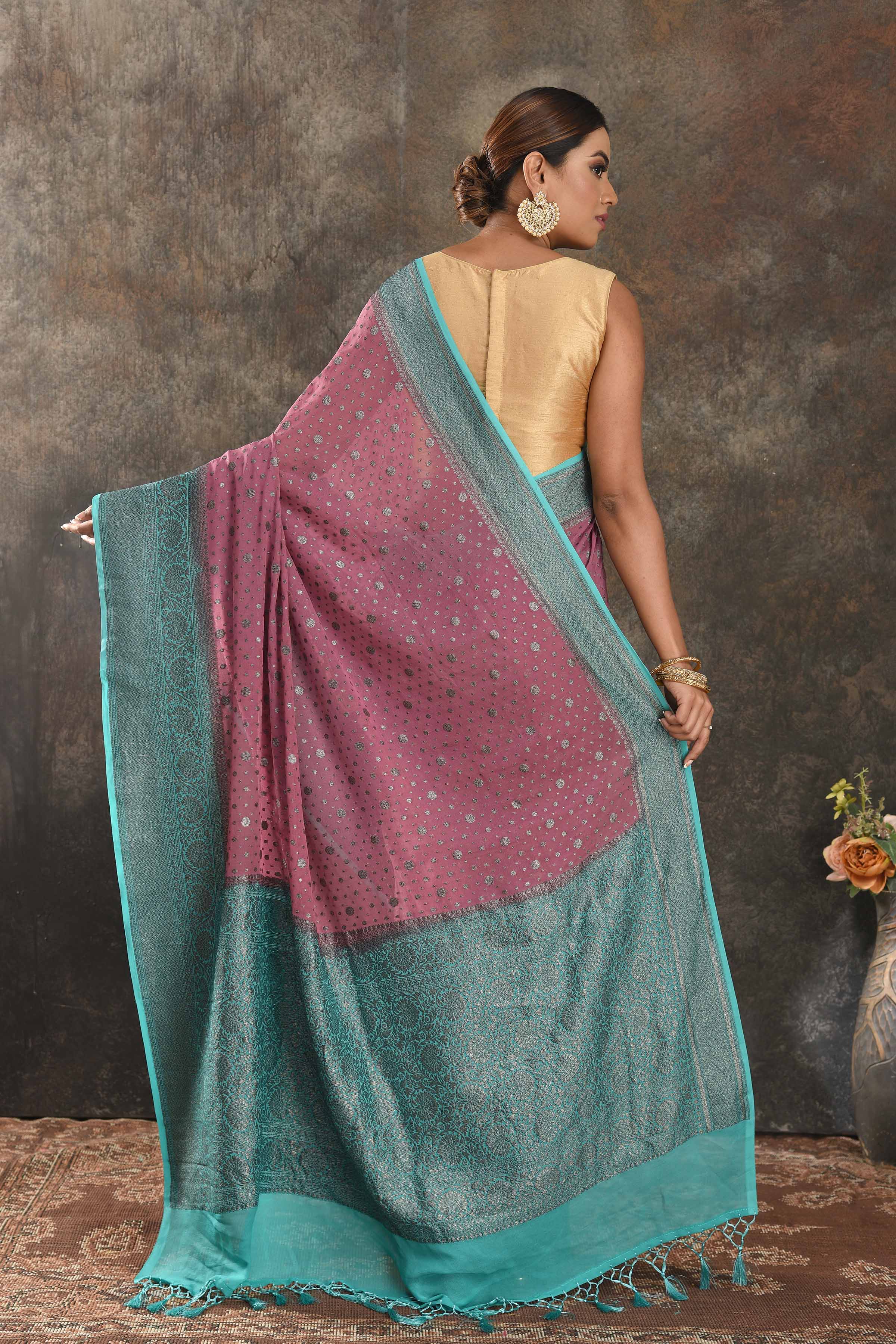 Shop gorgeous pink georgette sari online in USA with antique zari sea green border. Be vision of elegance on special occasions in exquisite designer sarees, handwoven sarees, georgette sarees, embroidered sarees, Banarasi sarees from Pure Elegance Indian saree store in USA.-back