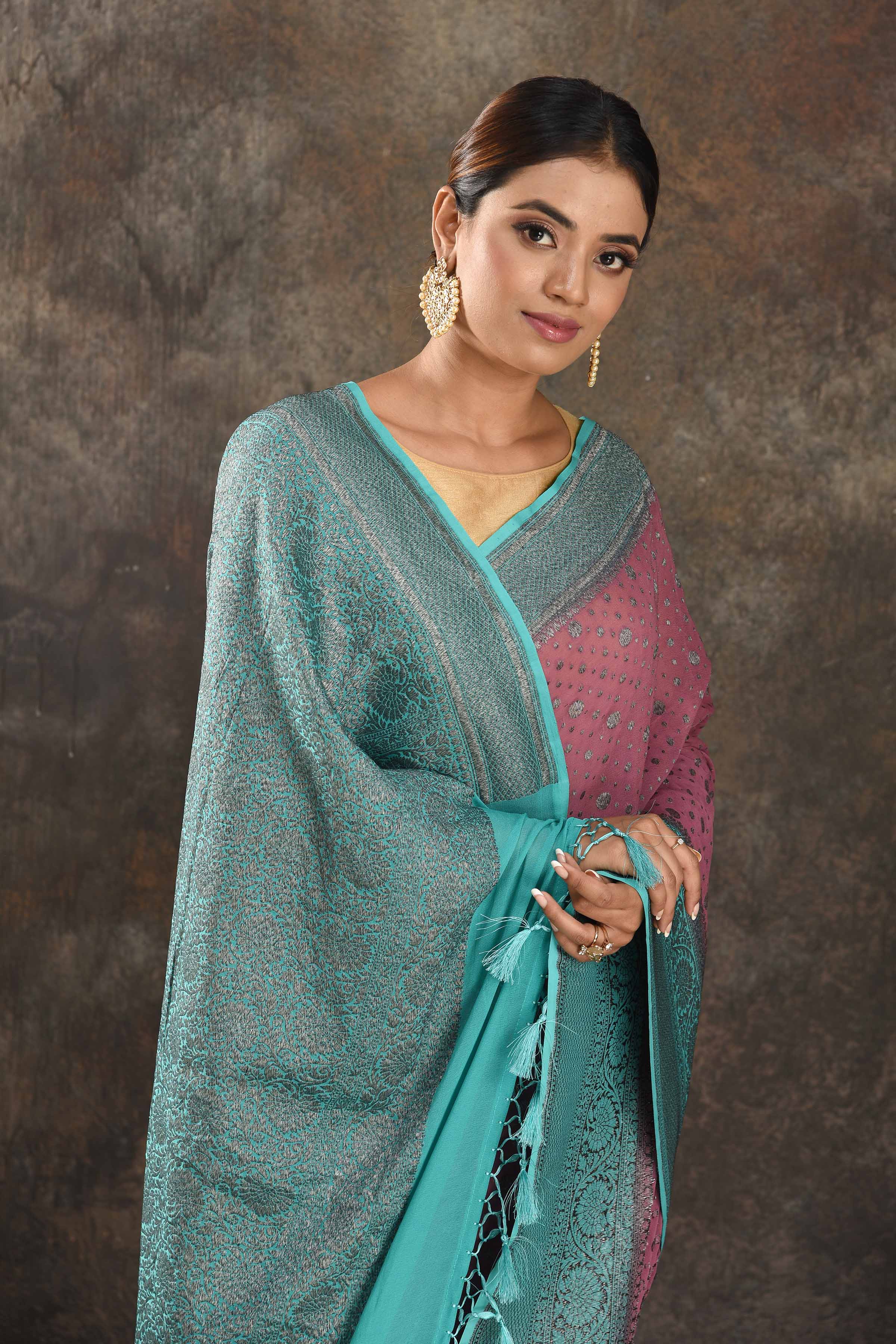 Shop gorgeous pink georgette sari online in USA with antique zari sea green border. Be vision of elegance on special occasions in exquisite designer sarees, handwoven sarees, georgette sarees, embroidered sarees, Banarasi sarees from Pure Elegance Indian saree store in USA.-closeup