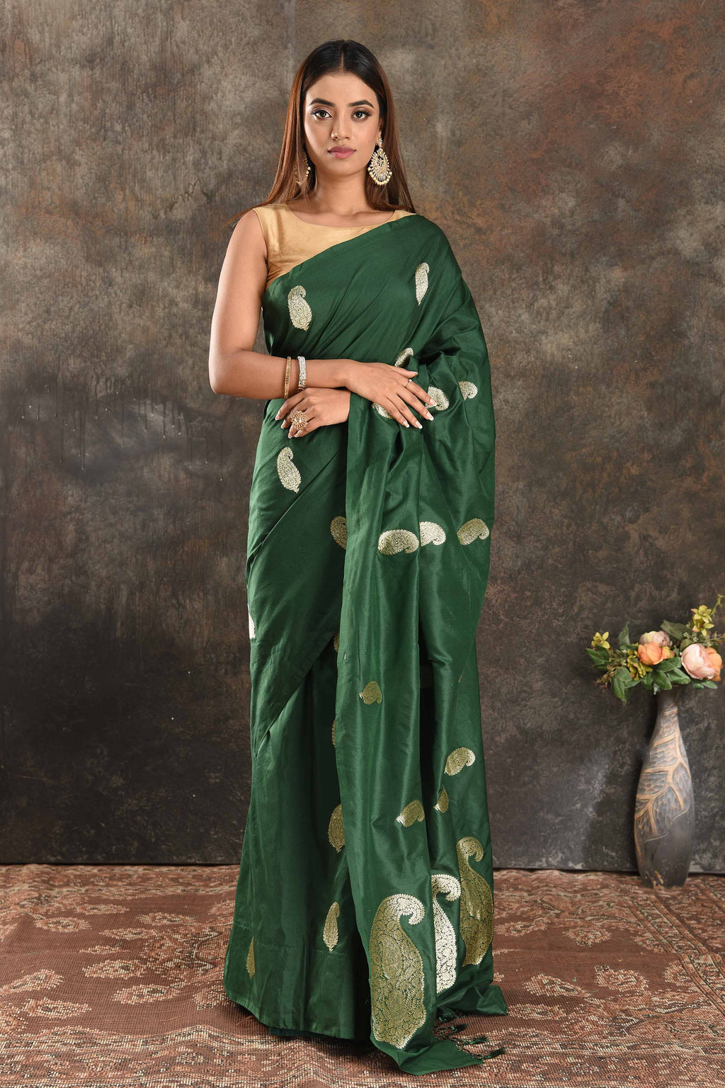 Buy stunning dark green silk saree online in USA with silver zari paisley buta. Be vision of elegance on special occasions in exquisite designer sarees, handwoven sarees, georgette sarees, embroidered sarees, Banarasi sarees from Pure Elegance Indian saree store in USA.-full view