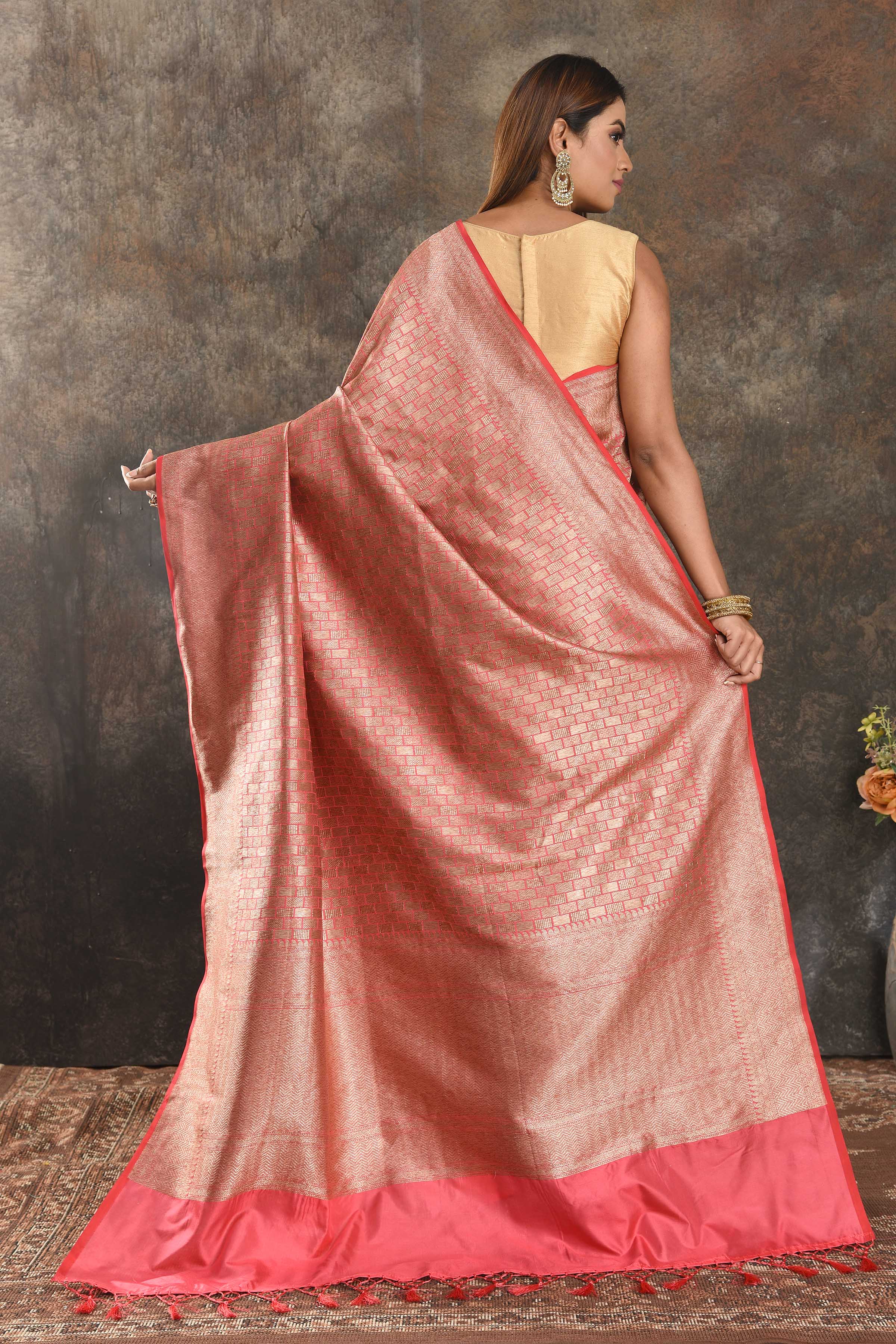 Buy peachish pink Banarasi silk saree online in USA with overall zari work. Be vision of elegance on special occasions in exquisite designer sarees, handwoven sarees, georgette sarees, embroidered sarees, Banarasi sarees from Pure Elegance Indian saree store in USA.-back