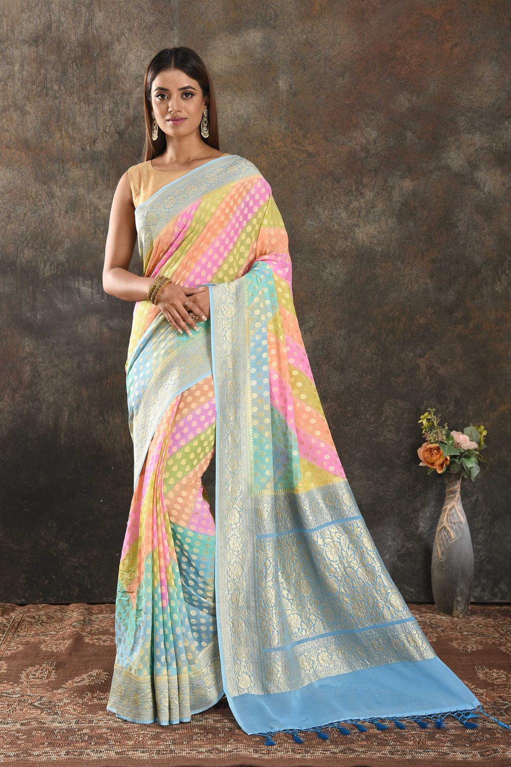 Buy stunning pastel multicolor georgette Banarasi sari online in USA with blue zari border. Be vision of elegance on special occasions in exquisite designer sarees, handwoven sarees, georgette sarees, embroidered sarees, Banarasi sarees from Pure Elegance Indian saree store in USA.-full view