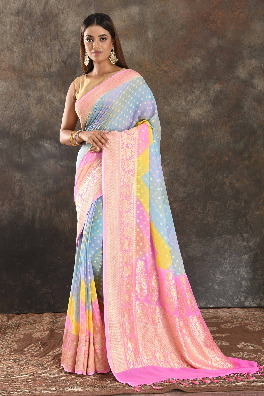 Shop pastel blue georgette Banarasi saree online in USA with pink zari border. Be vision of elegance on special occasions in exquisite designer sarees, handwoven sarees, georgette sarees, embroidered sarees, Banarasi sarees from Pure Elegance Indian saree store in USA.-full view
