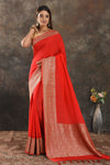 Shop stunning red crepe saree online in USA with zari border. Be vision of elegance on special occasions in exquisite designer sarees, handwoven sarees, georgette sarees, embroidered sarees, Banarasi sarees from Pure Elegance Indian saree store in USA.-full view