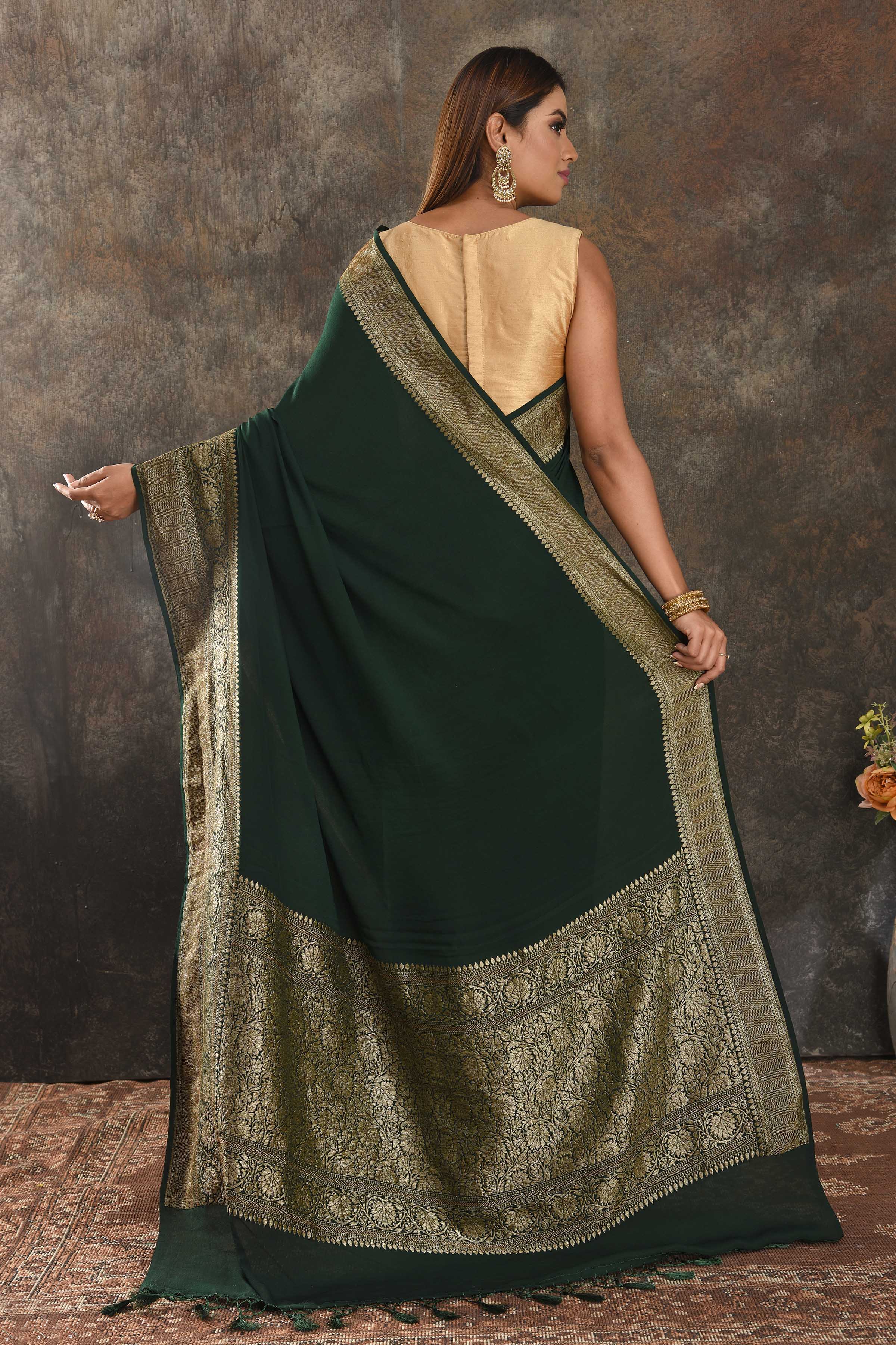 Shop beautiful bottle green crepe saree online in USA with antique zari border. Be vision of elegance on special occasions in exquisite designer sarees, handwoven sarees, georgette sarees, embroidered sarees, Banarasi sarees from Pure Elegance Indian saree store in USA.-back