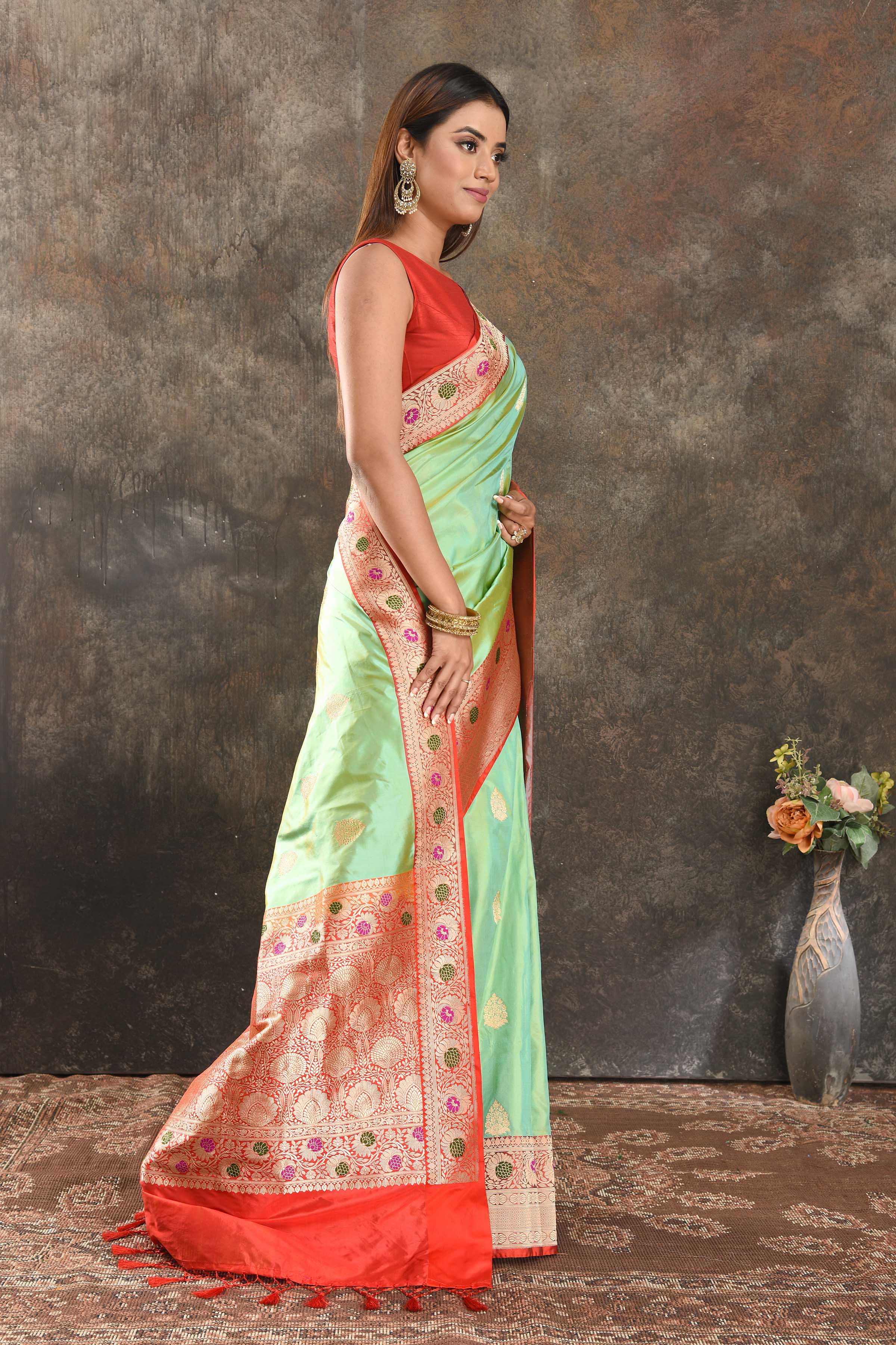 Buy beautiful pista green silk saree online in USA with red minakari zari border. Be vision of elegance on special occasions in exquisite designer sarees, handwoven sarees, georgette sarees, embroidered sarees, Banarasi saree, pure silk saris from Pure Elegance Indian saree store in USA.-side