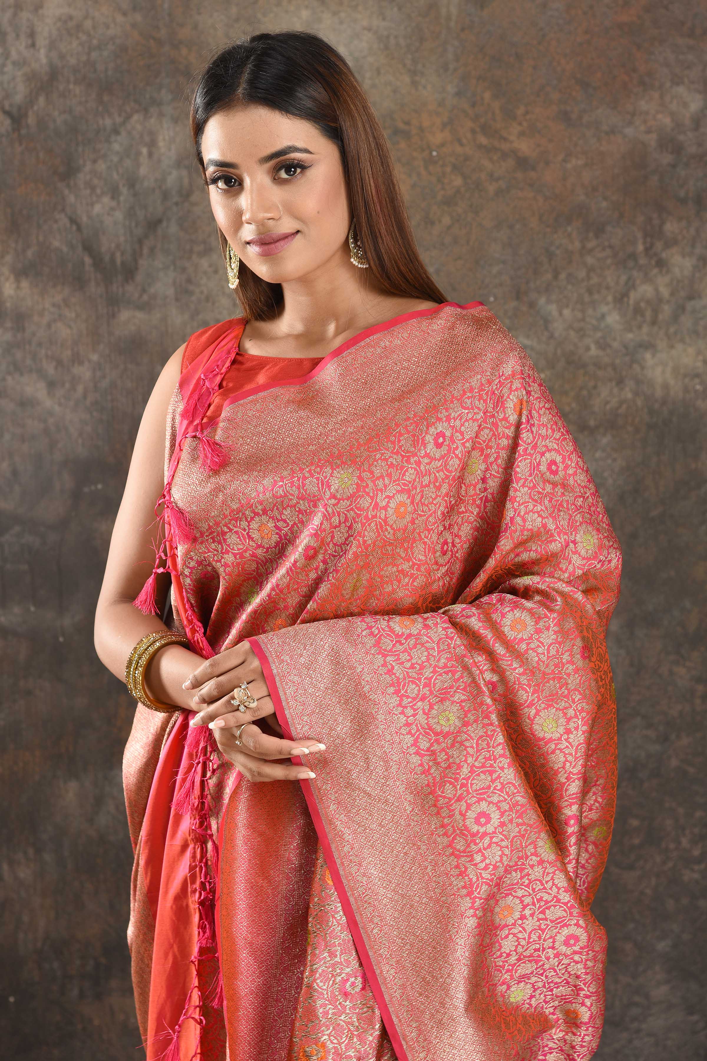Shop stunning orangish pink silk saree online in USA with overall zari jaal. Be vision of elegance on special occasions in exquisite designer sarees, handwoven sarees, georgette sarees, embroidered sarees, Banarasi saree, pure silk saris from Pure Elegance Indian saree store in USA.-closeup