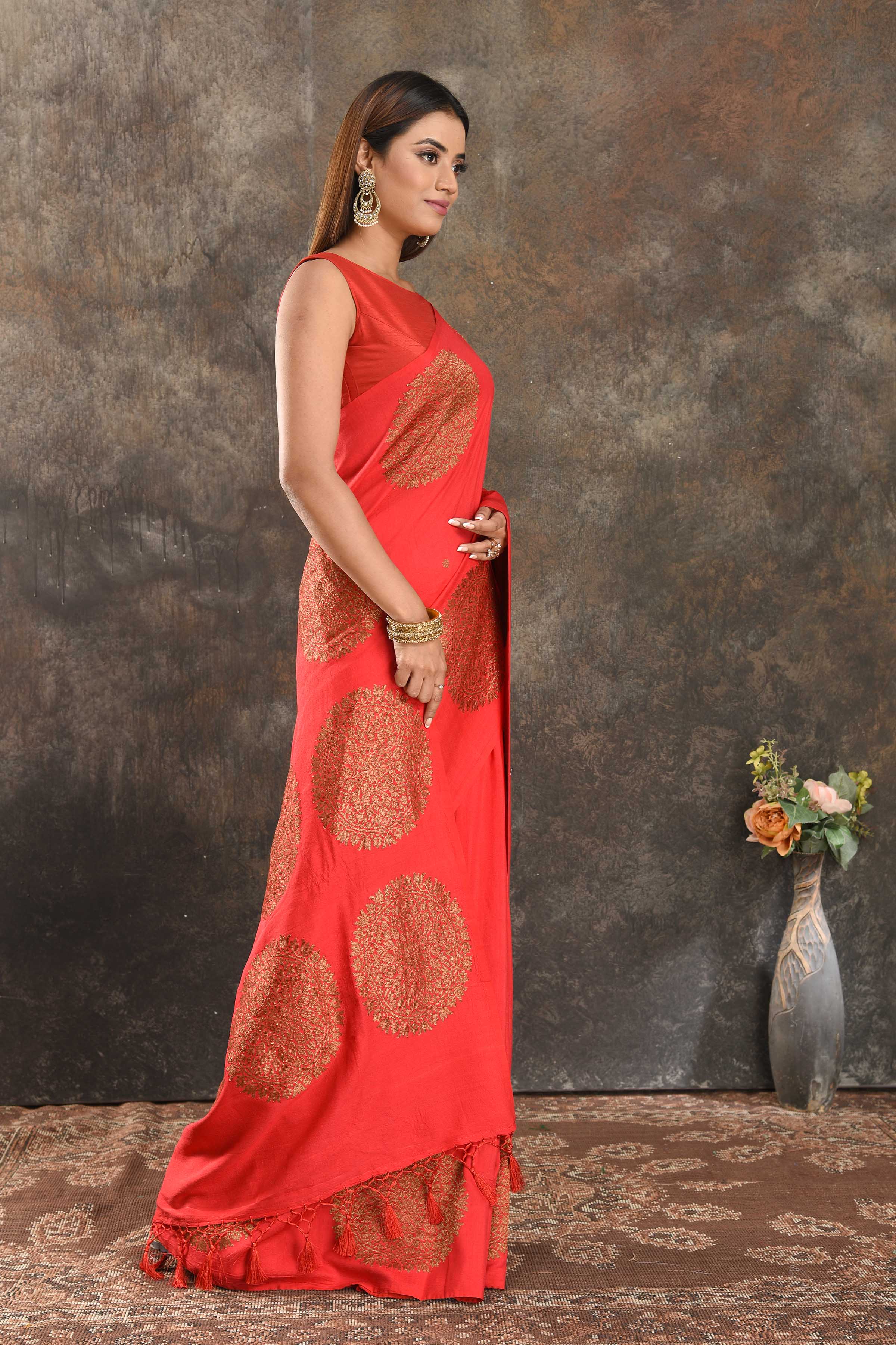 Shop red Muga Banarasi saree online in USA with antique zari motifs. Be vision of elegance on special occasions in exquisite designer sarees, handwoven sarees, georgette sarees, embroidered sarees, Banarasi saree, pure silk saris from Pure Elegance Indian saree store in USA.-side