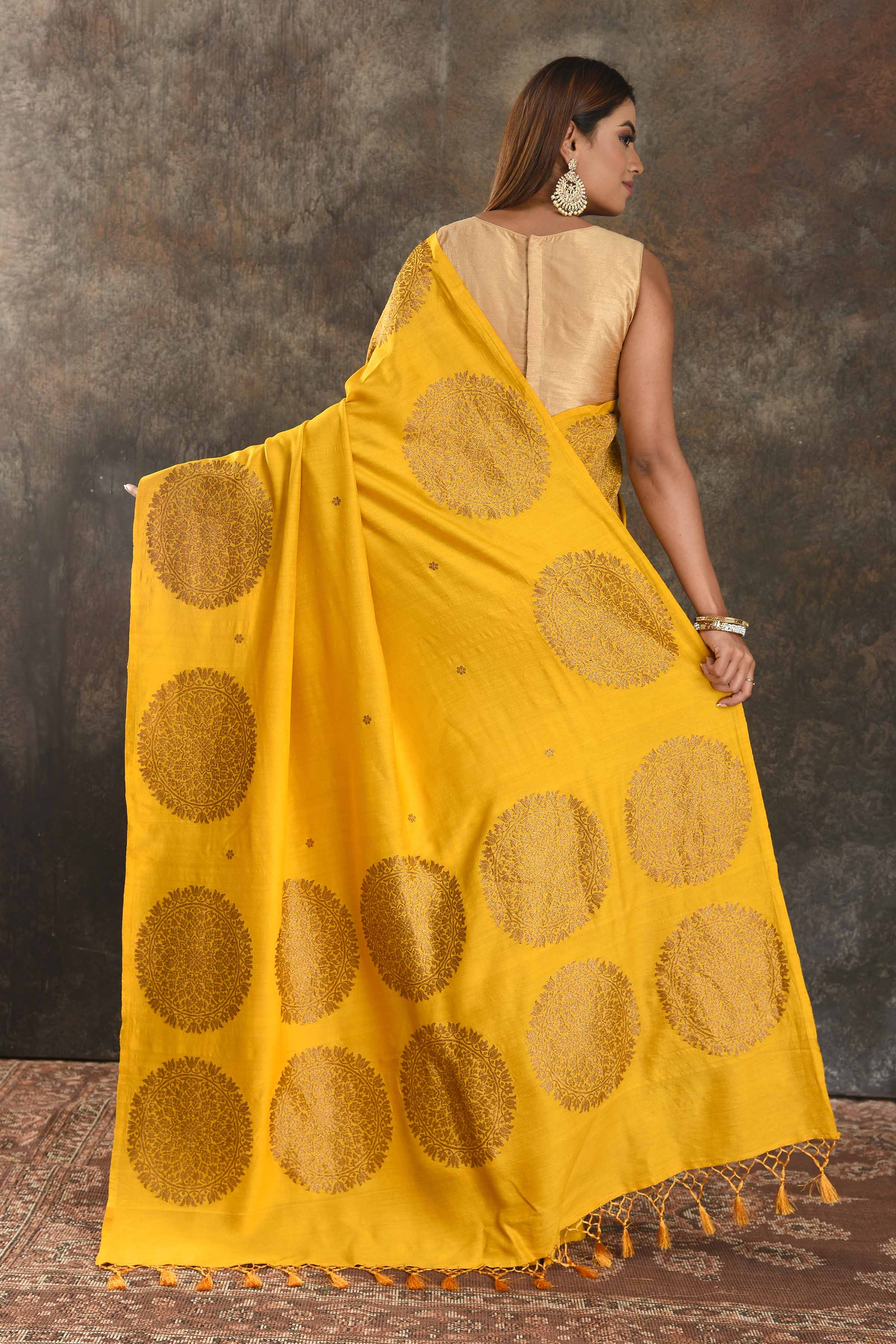 Buy yellow Muga Banarasi sari online in USA with antique zari motifs. Be vision of elegance on special occasions in exquisite designer sarees, handwoven sarees, georgette sarees, embroidered sarees, Banarasi saree, pure silk saris from Pure Elegance Indian saree store in USA.-back