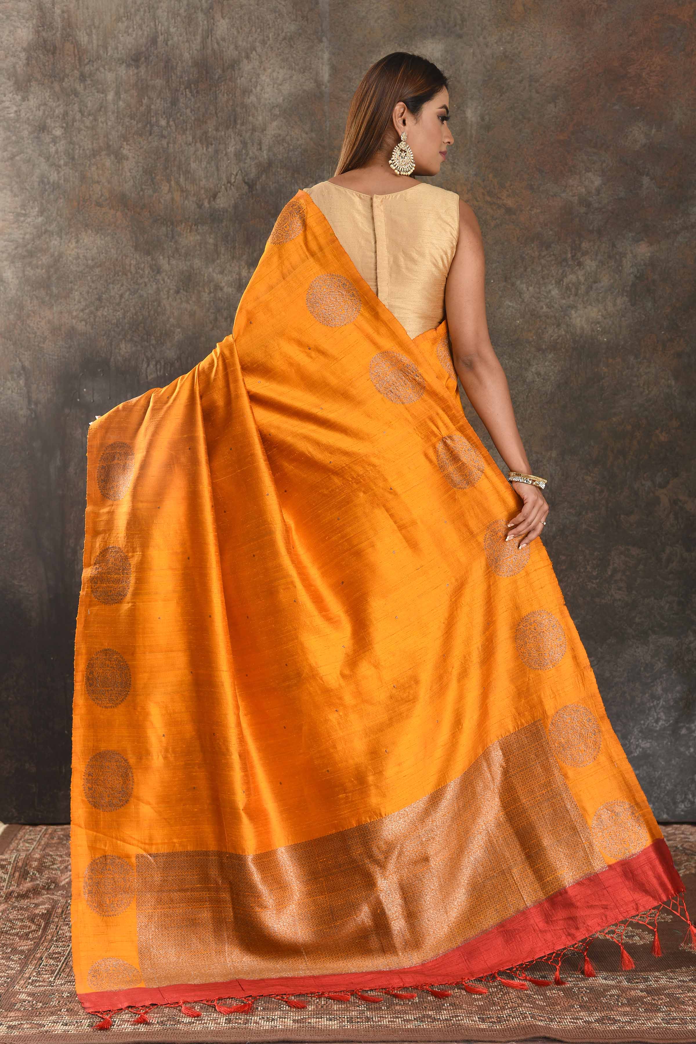 Shop beautiful mango yellow tussar Banarasi sari online in USA with antique zari buta. Be vision of elegance on special occasions in exquisite designer sarees, handwoven sarees, georgette sarees, embroidered sarees, Banarasi saree, pure silk saris from Pure Elegance Indian saree store in USA.-back