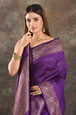 Buy beautiful purple tussar Banarasi sari online in USA with antique zari border. Be vision of elegance on special occasions in exquisite designer sarees, handwoven sarees, georgette sarees, embroidered sarees, Banarasi saree, pure silk saris, tussar sarees from Pure Elegance Indian saree store in USA.-closeup