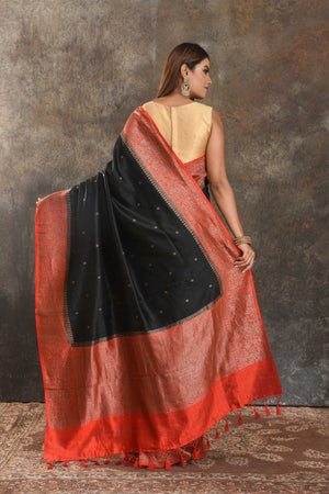 Buy black tussar Banarasi sari online in USA with red antique zari border. Be vision of elegance on special occasions in exquisite designer sarees, handwoven sarees, georgette sarees, embroidered sarees, Banarasi saree, pure silk saris, tussar sarees from Pure Elegance Indian saree store in USA.-back