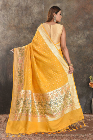 Buy beautiful mango yellow tussar Banarasi sari online in USA with floral zari border. Be vision of elegance on special occasions in exquisite designer sarees, handwoven sarees, georgette sarees, embroidered sarees, Banarasi saree, pure silk saris, tussar sarees from Pure Elegance Indian saree store in USA.-back