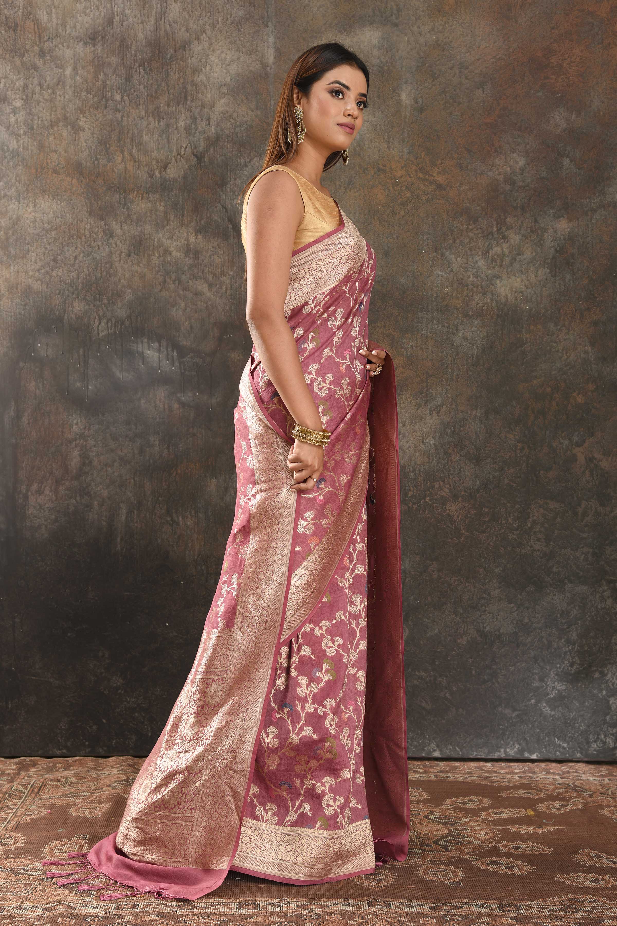 Shop beautiful onion pink tussar Banarasi saree online in USA with floral zari jaal. Be vision of elegance on special occasions in exquisite designer sarees, handwoven sarees, georgette sarees, embroidered sarees, Banarasi saree, pure silk saris, tussar sarees from Pure Elegance Indian saree store in USA.-side