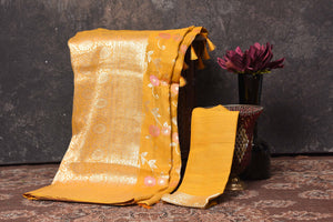 Buy beautiful mango yellow tussar Banarasi sari online in USA with floral zari minakari jaal. Be vision of elegance on special occasions in exquisite designer sarees, handwoven sarees, georgette sarees, embroidered sarees, Banarasi saree, pure silk saris, tussar sarees from Pure Elegance Indian saree store in USA.-blouse