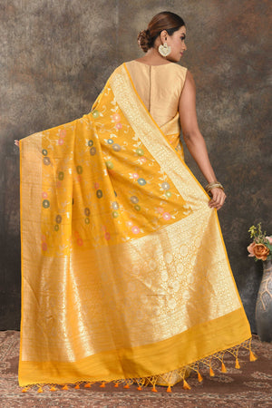 Buy beautiful mango yellow tussar Banarasi sari online in USA with floral zari minakari jaal. Be vision of elegance on special occasions in exquisite designer sarees, handwoven sarees, georgette sarees, embroidered sarees, Banarasi saree, pure silk saris, tussar sarees from Pure Elegance Indian saree store in USA.-back