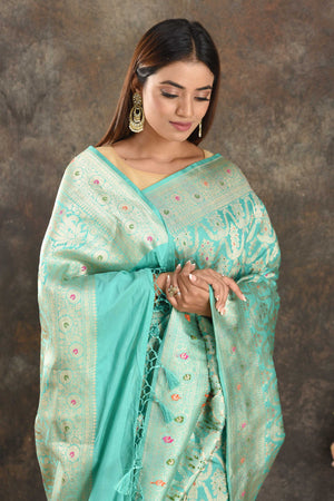 Shop pastel blue Katan silk Banarasi saree online in USA with zari work. Be vision of elegance on special occasions in exquisite designer sarees, handwoven sarees, georgette sarees, embroidered sarees, Banarasi saree, pure silk saris, tussar sarees from Pure Elegance Indian saree store in USA.-closeup