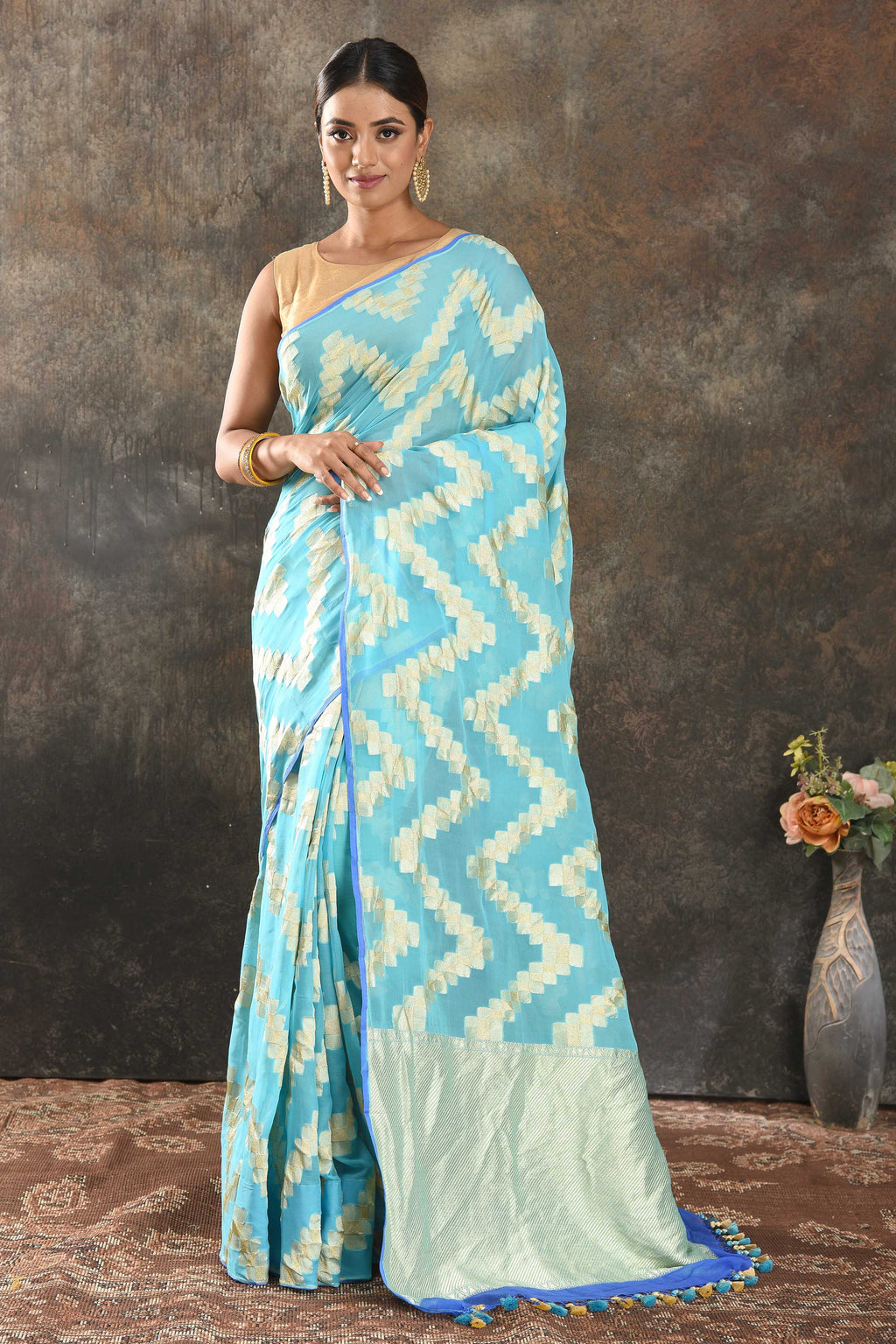 Shop sky blue borderless georgette saree online in USA with golden chevron design. Be the center of attraction on special occasions in ethnic sarees, designer sarees, embroidered sarees, handwoven sarees, pure silk sarees from Pure Elegance Indian saree store in USA.-full view
