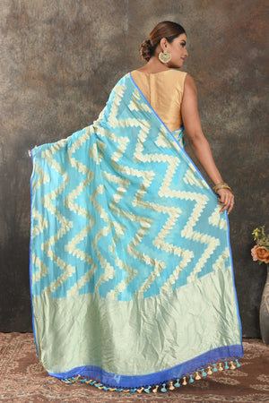 Shop sky blue borderless georgette saree online in USA with golden chevron design. Be the center of attraction on special occasions in ethnic sarees, designer sarees, embroidered sarees, handwoven sarees, pure silk sarees from Pure Elegance Indian saree store in USA.-back