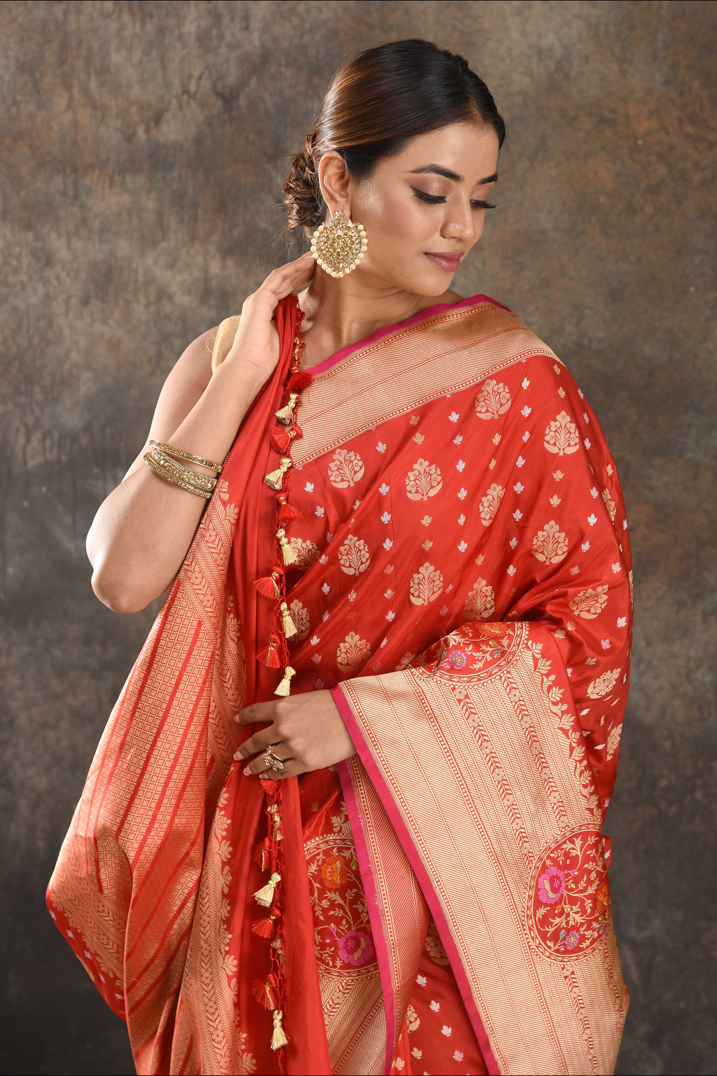 Buy red fancy Katan silk saree online in USA with overall zari buta and border. Be the center of attraction on special occasions in ethnic sarees, designer sarees, embroidered sarees, handwoven sarees, pure silk sarees from Pure Elegance Indian saree store in USA.-closeup