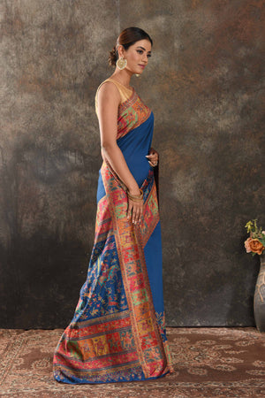 Shop stunning blue Kani silk saree online in USA. Keep your ethnic wardrobe up to date with latest designer sarees, pure silk sarees, handwoven saris, tussar silk sarees, Kani sarees, Pashmina sarees, embroidered sarees from Pure Elegance Indian saree store in USA.-side