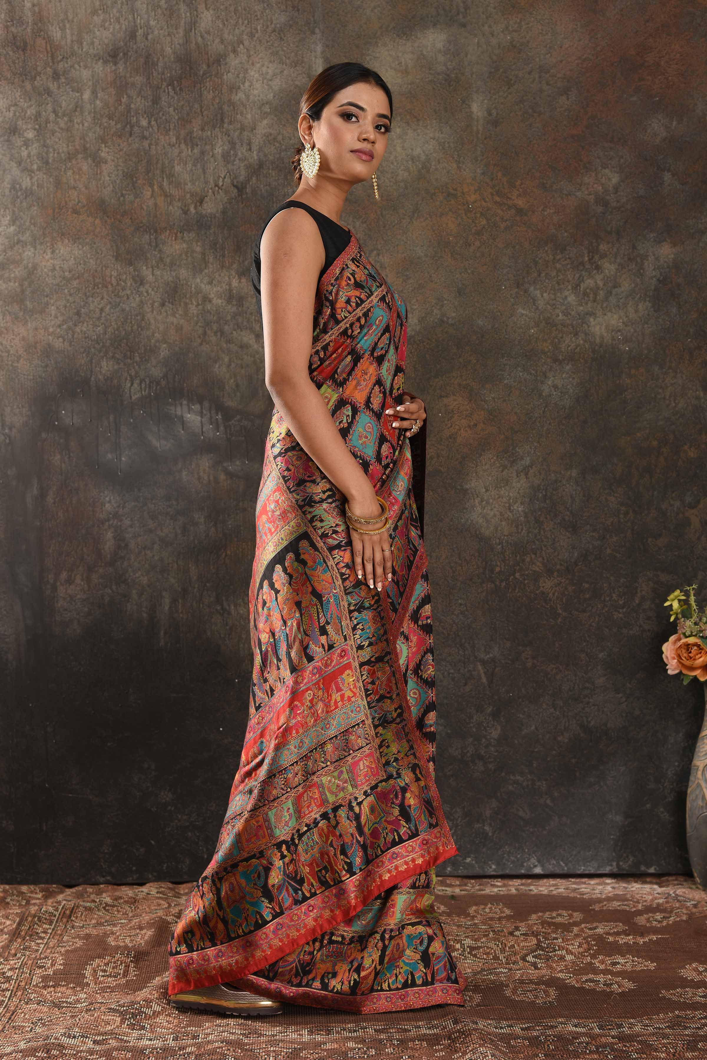 Buy stunning black Kani silk sari online in USA. Keep your ethnic wardrobe up to date with latest designer sarees, pure silk sarees, handwoven saris, tussar silk sarees, Kani sarees, Pashmina sarees, embroidered sarees from Pure Elegance Indian saree store in USA.-side