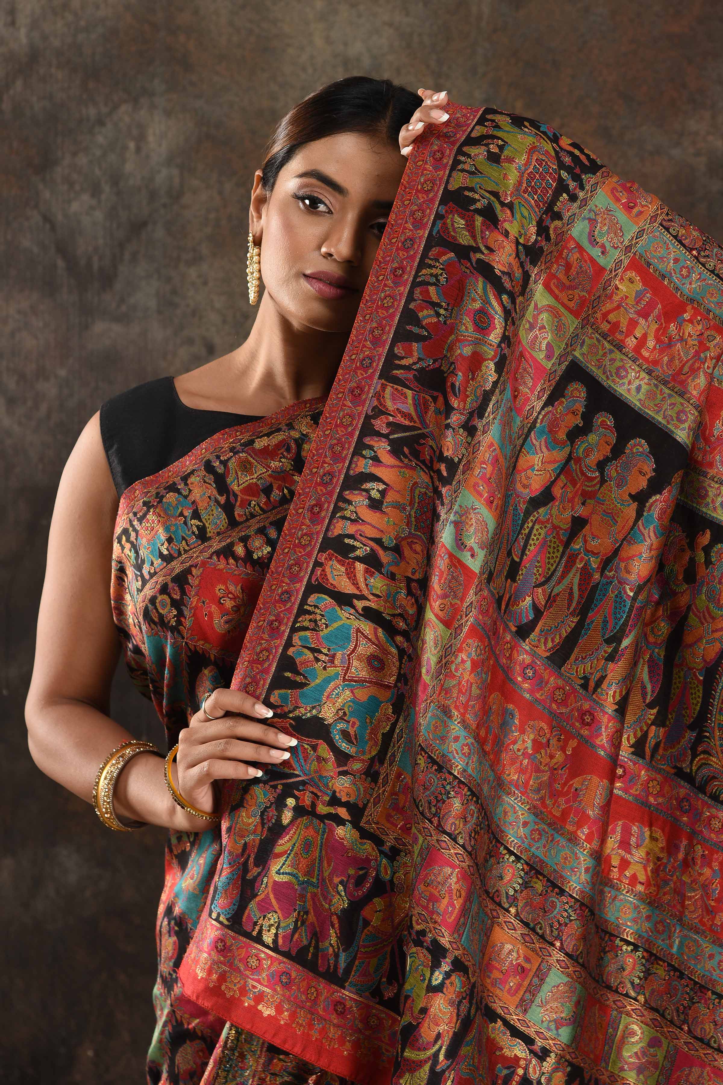 Buy stunning black Kani silk sari online in USA. Keep your ethnic wardrobe up to date with latest designer sarees, pure silk sarees, handwoven saris, tussar silk sarees, Kani sarees, Pashmina sarees, embroidered sarees from Pure Elegance Indian saree store in USA.-closeup