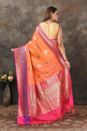 Shop orange Banarasi sari online in USA with purple pink zari border. Look royal at weddings and festive occasions in exquisite Banarasi saris, handwoven sarees, tussar silk sarees, Bollywood sarees, partywear sarees from Pure Elegance Indian saree store in USA.-back