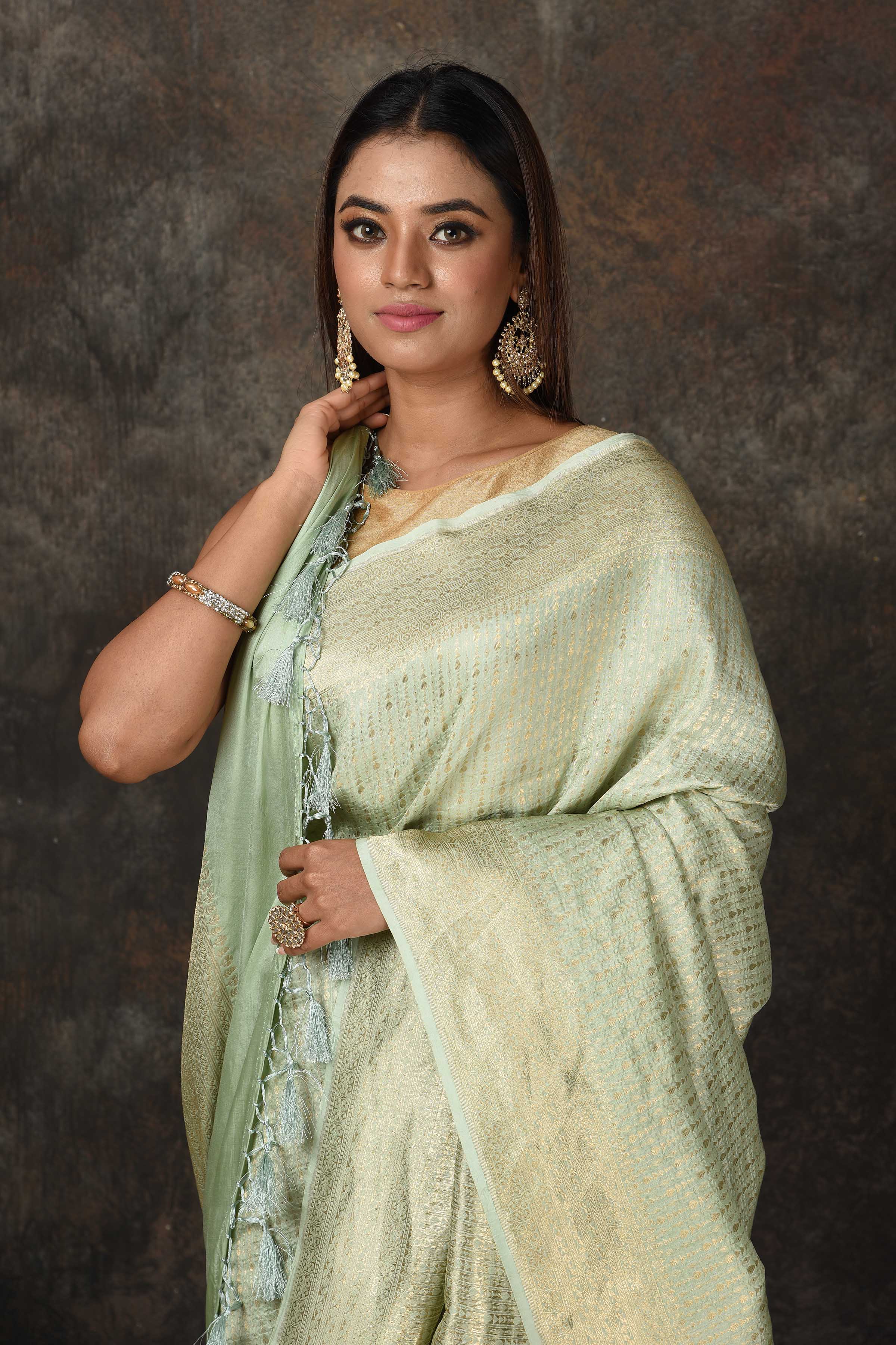 Shop stunning mint green Banarasi sari online in USA with overall zari work. Look royal at weddings and festive occasions in exquisite Banarasi saris, handwoven sarees, tussar silk sarees, Bollywood sarees, partywear sarees from Pure Elegance Indian saree store in USA.-closeup
