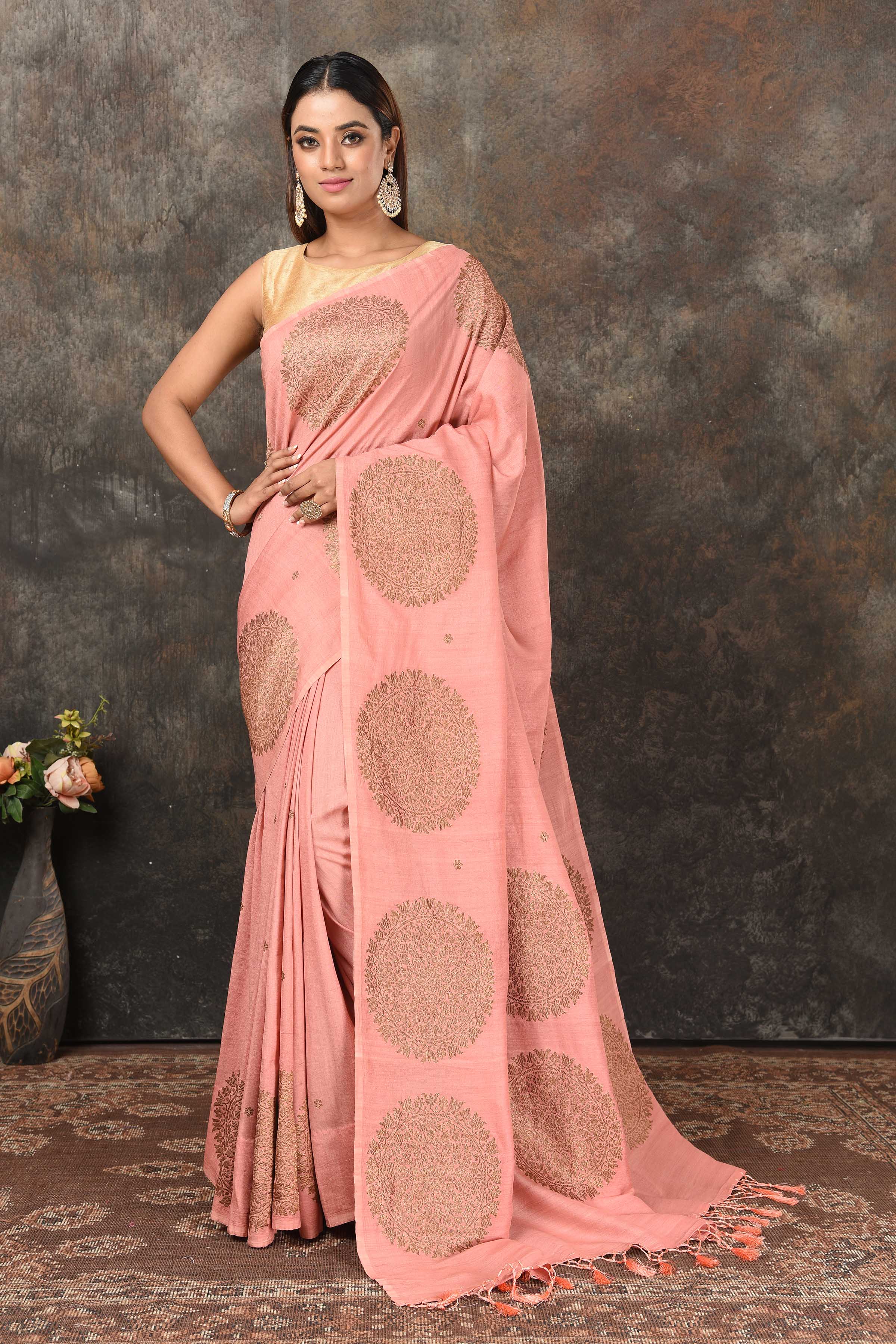 Shop blush pink Benarasi sari online in USA with antique zari motifs. Look royal at weddings and festive occasions in exquisite Banarasi saris, handwoven sarees, tussar silk sarees, Bollywood sarees, partywear sarees from Pure Elegance Indian saree store in USA.-full view