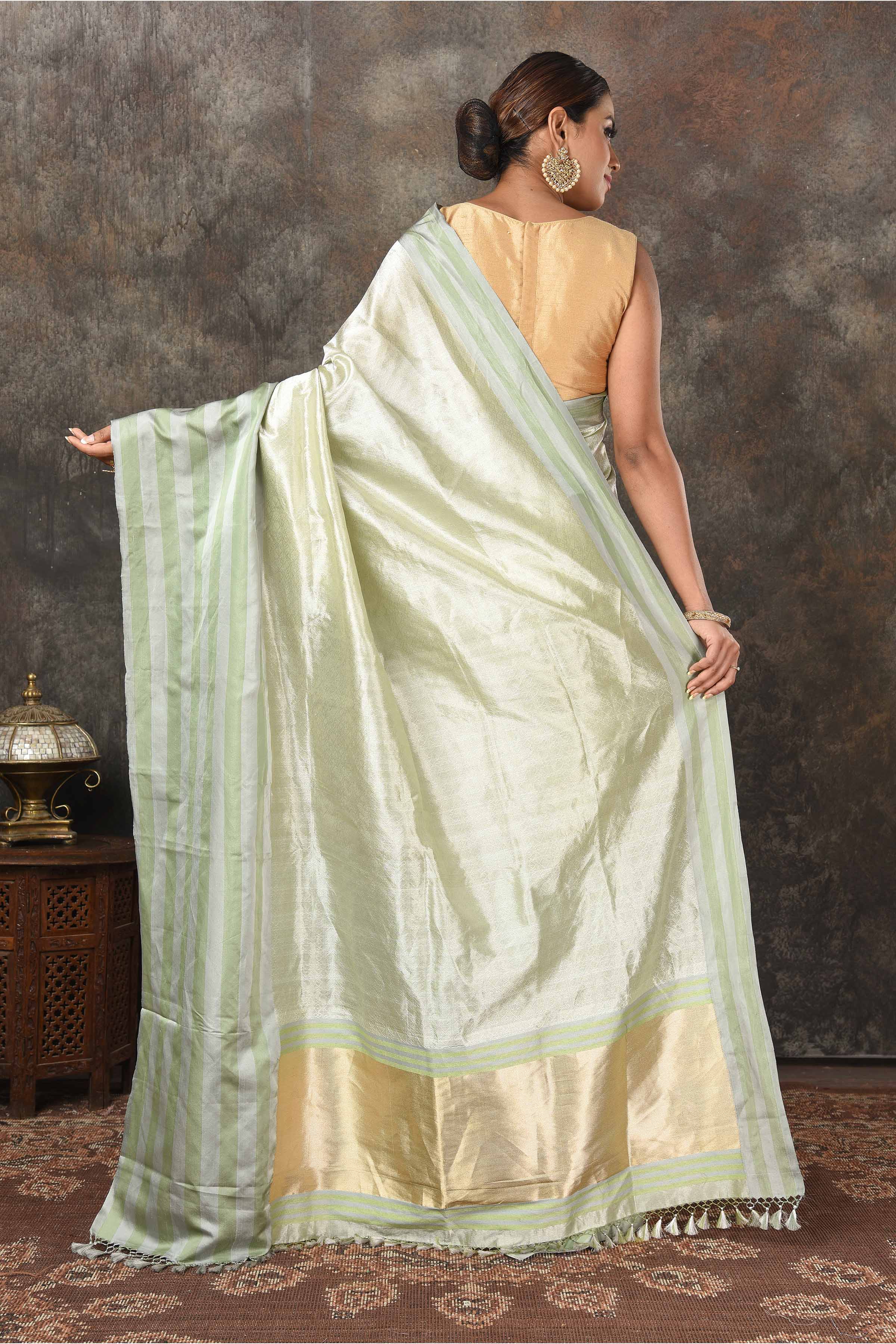 Buy beautiful pista green Banarasi silk sari online in USA with stripes border. Radiate elegance on special occasions in exquisite designer sarees, handwoven sarees, georgette sarees, embroidered sarees, Banarasi saree, pure silk saris, tussar sarees from Pure Elegance Indian saree store in USA.-back