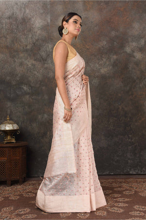 Buy beautiful powder pink linen Banarasi sari online in USA with embroidery. Radiate elegance on special occasions in exquisite designer sarees, handwoven sarees, georgette sarees, embroidered sarees, Banarasi saree, pure silk saris, tussar sarees from Pure Elegance Indian saree store in USA.-side