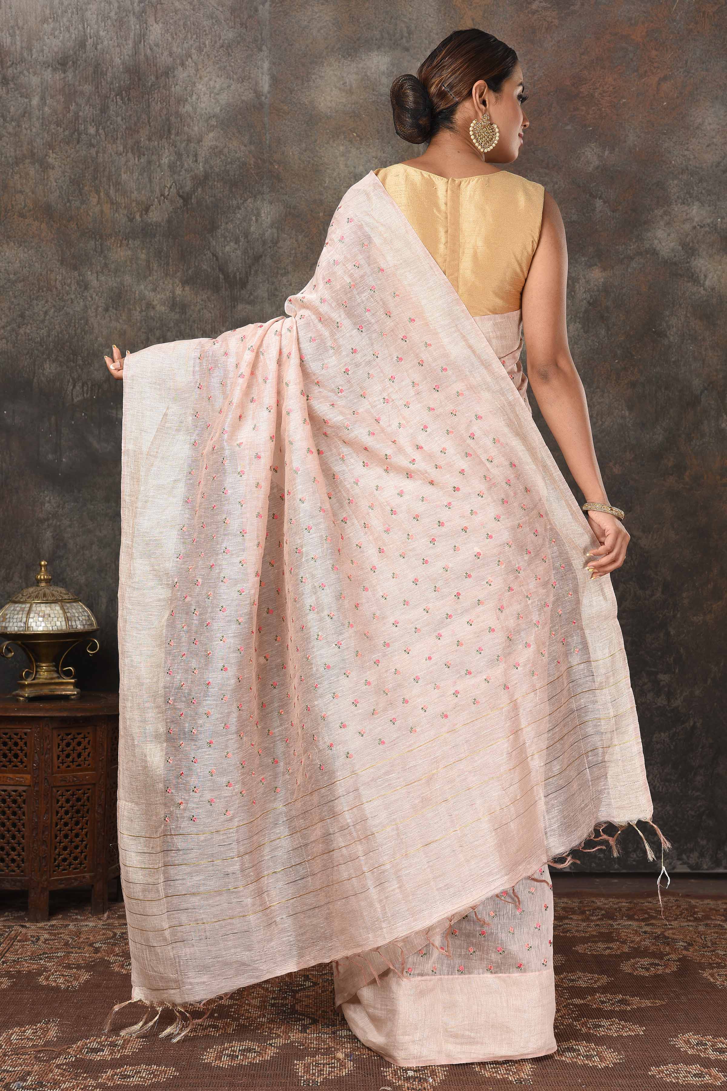 Buy beautiful powder pink linen Banarasi sari online in USA with embroidery. Radiate elegance on special occasions in exquisite designer sarees, handwoven sarees, georgette sarees, embroidered sarees, Banarasi saree, pure silk saris, tussar sarees from Pure Elegance Indian saree store in USA.-back