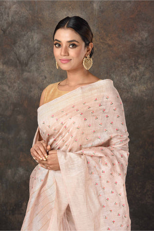 Buy beautiful powder pink linen Banarasi sari online in USA with embroidery. Radiate elegance on special occasions in exquisite designer sarees, handwoven sarees, georgette sarees, embroidered sarees, Banarasi saree, pure silk saris, tussar sarees from Pure Elegance Indian saree store in USA.-closeup