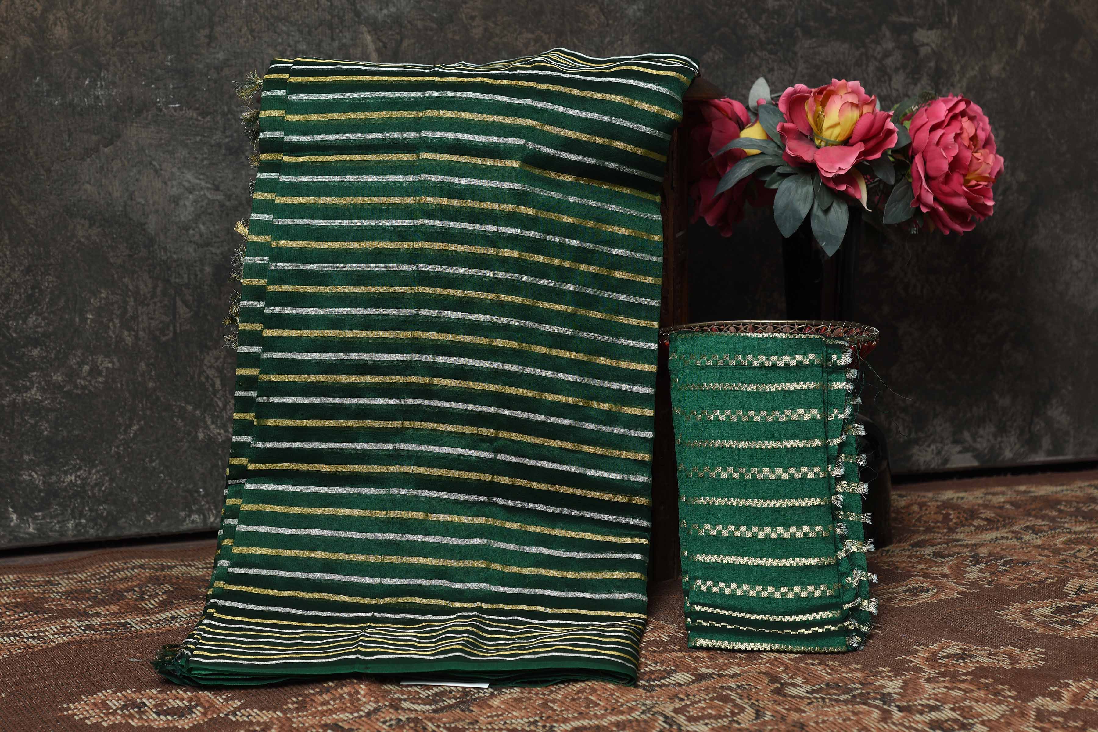 Shop stunning bottle green striped tissue Banarasi sari online in USA. Radiate elegance on special occasions in exquisite designer sarees, handwoven sarees, georgette sarees, embroidered sarees, Banarasi saree, pure silk saris, tussar sarees from Pure Elegance Indian saree store in USA.-blouse