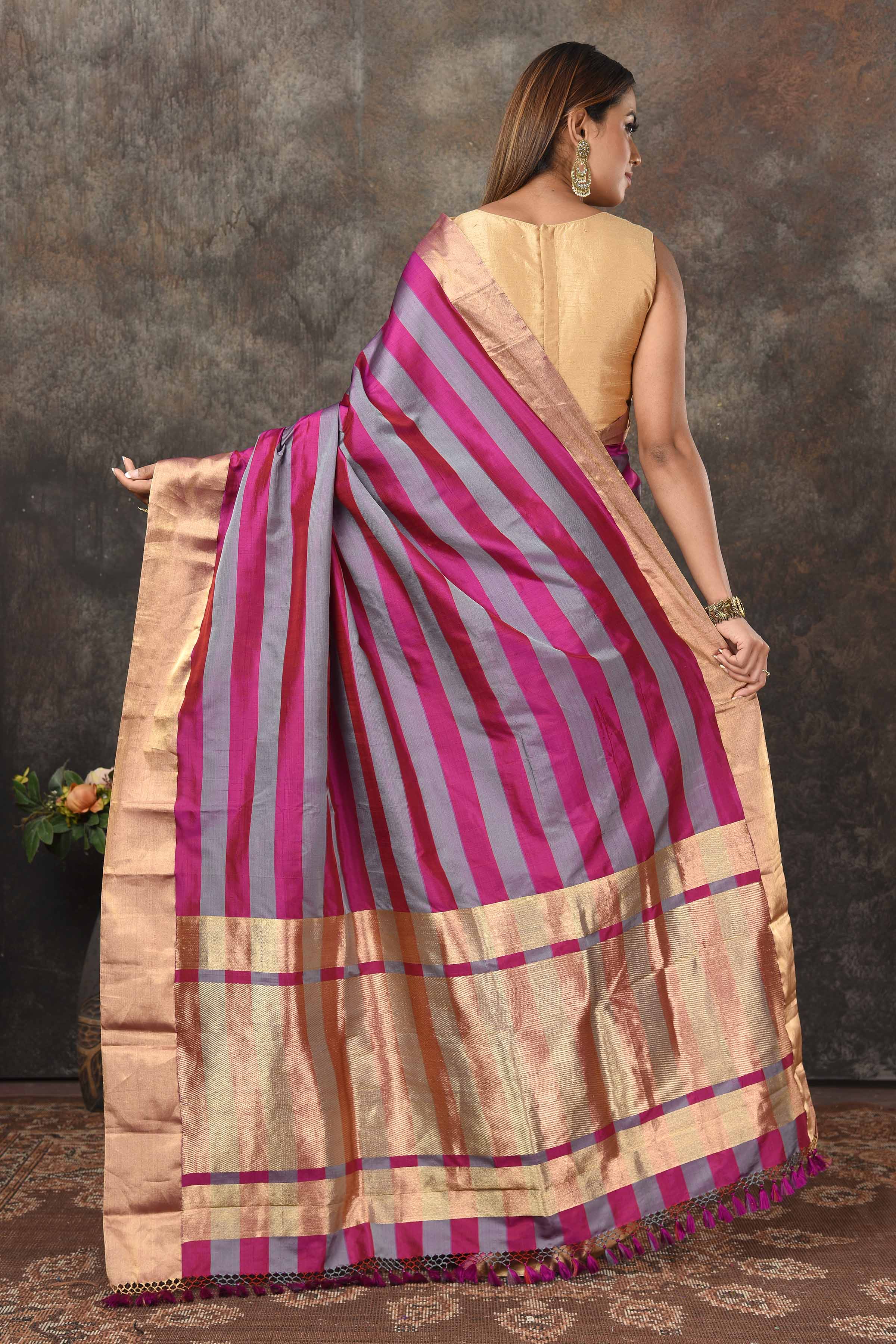Buy beautiful magent grey stripes Banarasi Mashru silk sari online in USA with golden border. Radiate elegance on special occasions in exquisite designer sarees, handwoven sarees, georgette sarees, embroidered sarees, Banarasi saree, pure silk saris, tussar sarees from Pure Elegance Indian saree store in USA.-back