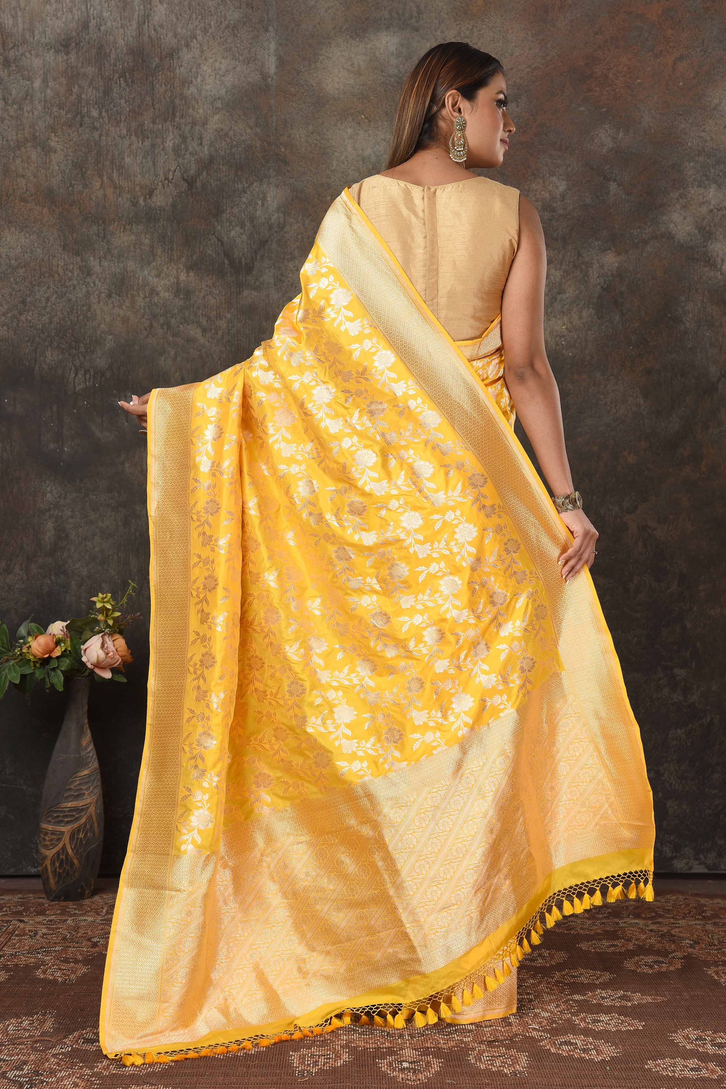 Buy stunning yellow Banarasi Mashru silk sari online in USA with golden zari jaal. Radiate elegance on special occasions in exquisite designer sarees, handwoven sarees, georgette sarees, embroidered sarees, Banarasi saree, pure silk saris, tussar sarees from Pure Elegance Indian saree store in USA.-back