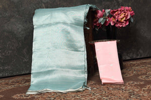 Buy beautiful pastel green tissue Banarasi saree online in USA. Radiate elegance on special occasions in exquisite designer sarees, handwoven sarees, georgette sarees, embroidered sarees, Banarasi saree, pure silk saris, tussar sarees from Pure Elegance Indian saree store in USA.-blouse