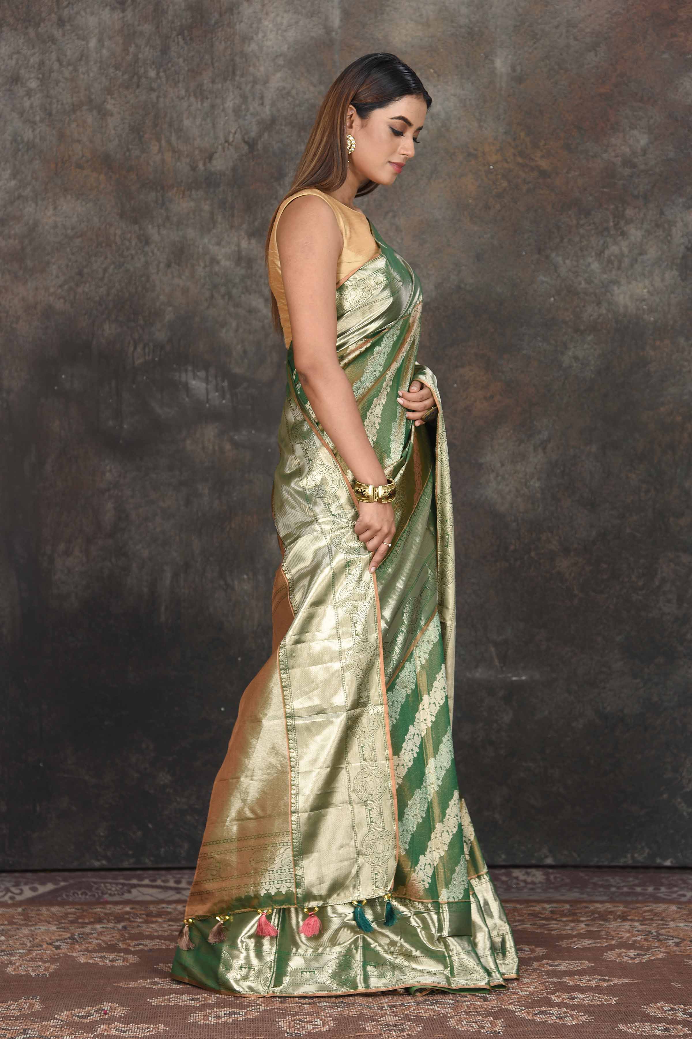 Buy beautiful mehendi green and silver tissue Kanjeevaram saree online in USA. Be the center of attraction on special occasions in ethnic sarees, designer sarees, embroidered sarees, handwoven sarees, pure silk sarees from Pure Elegance Indian saree store in USA.-side