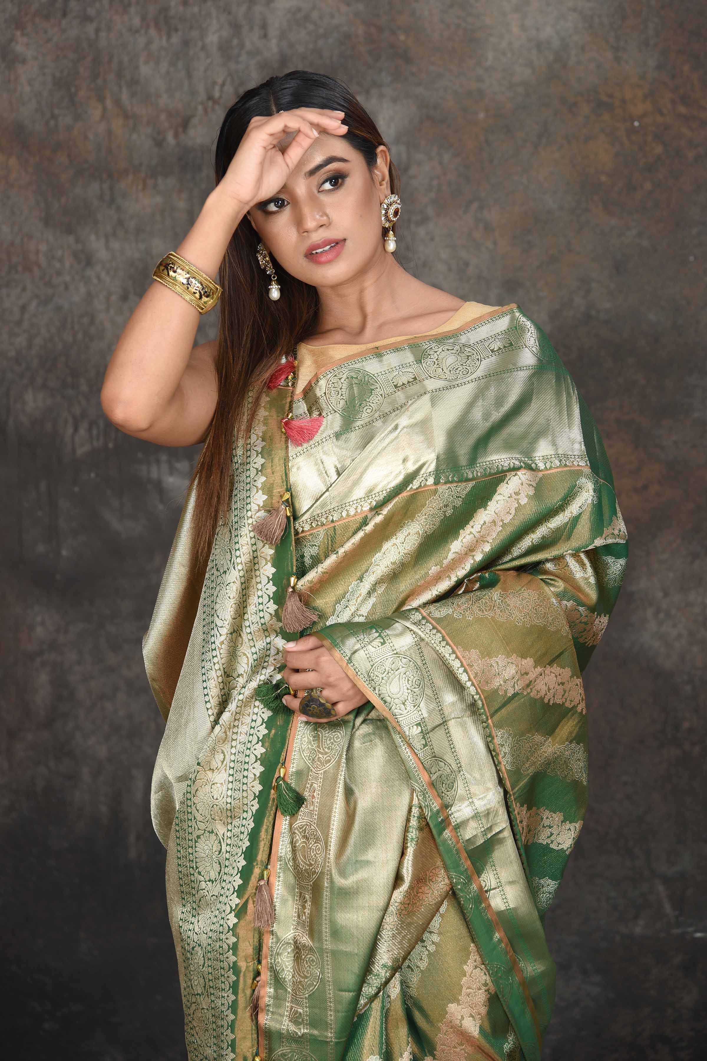 Buy beautiful mehendi green and silver tissue Kanjeevaram saree online in USA. Be the center of attraction on special occasions in ethnic sarees, designer sarees, embroidered sarees, handwoven sarees, pure silk sarees from Pure Elegance Indian saree store in USA.-closeup