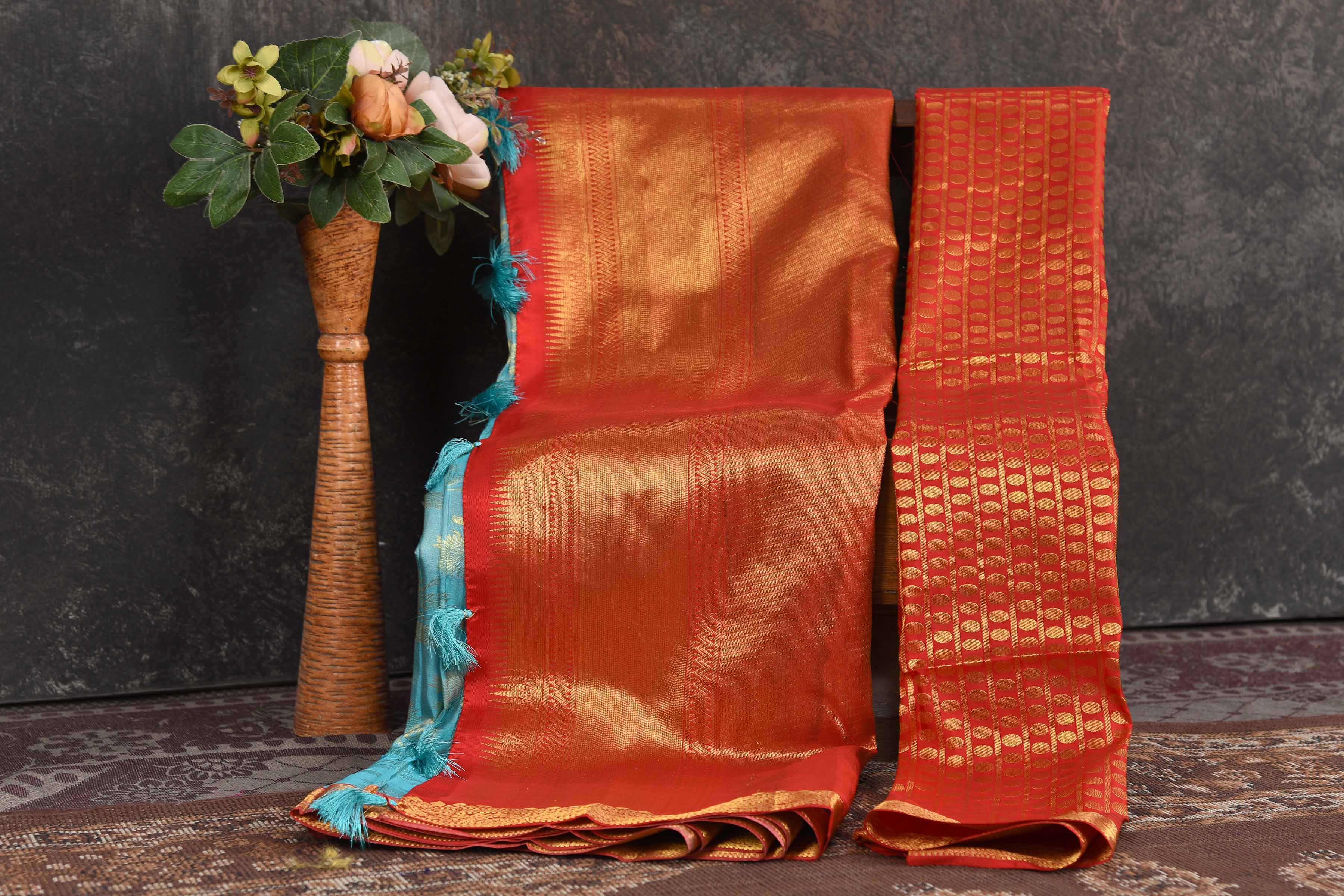 Buy light blue Kanjeevaram brocade sari online in USA with red zari border. Be the center of attraction on special occasions in ethnic sarees, designer sarees, embroidered sarees, handwoven sarees, pure silk sarees from Pure Elegance Indian saree store in USA.-blouse