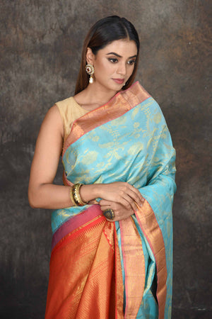 Buy light blue Kanjeevaram brocade sari online in USA with red zari border. Be the center of attraction on special occasions in ethnic sarees, designer sarees, embroidered sarees, handwoven sarees, pure silk sarees from Pure Elegance Indian saree store in USA.-closeup