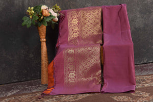 Buy stunning orange Kanjivaram soft silk sari online in USA with purple zari border. Be the center of attraction on special occasions in ethnic sarees, designer sarees, embroidered sarees, handwoven sarees, pure silk sarees from Pure Elegance Indian saree store in USA.-blouse