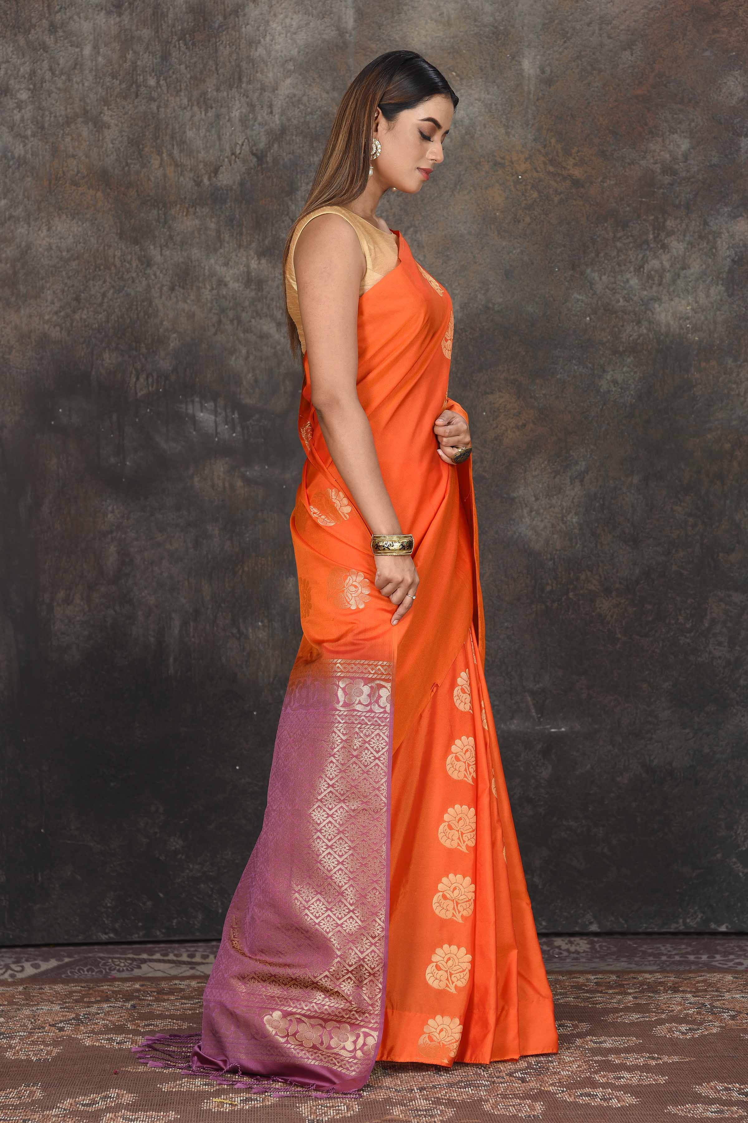 Buy stunning orange Kanjivaram soft silk sari online in USA with purple zari border. Be the center of attraction on special occasions in ethnic sarees, designer sarees, embroidered sarees, handwoven sarees, pure silk sarees from Pure Elegance Indian saree store in USA.-side