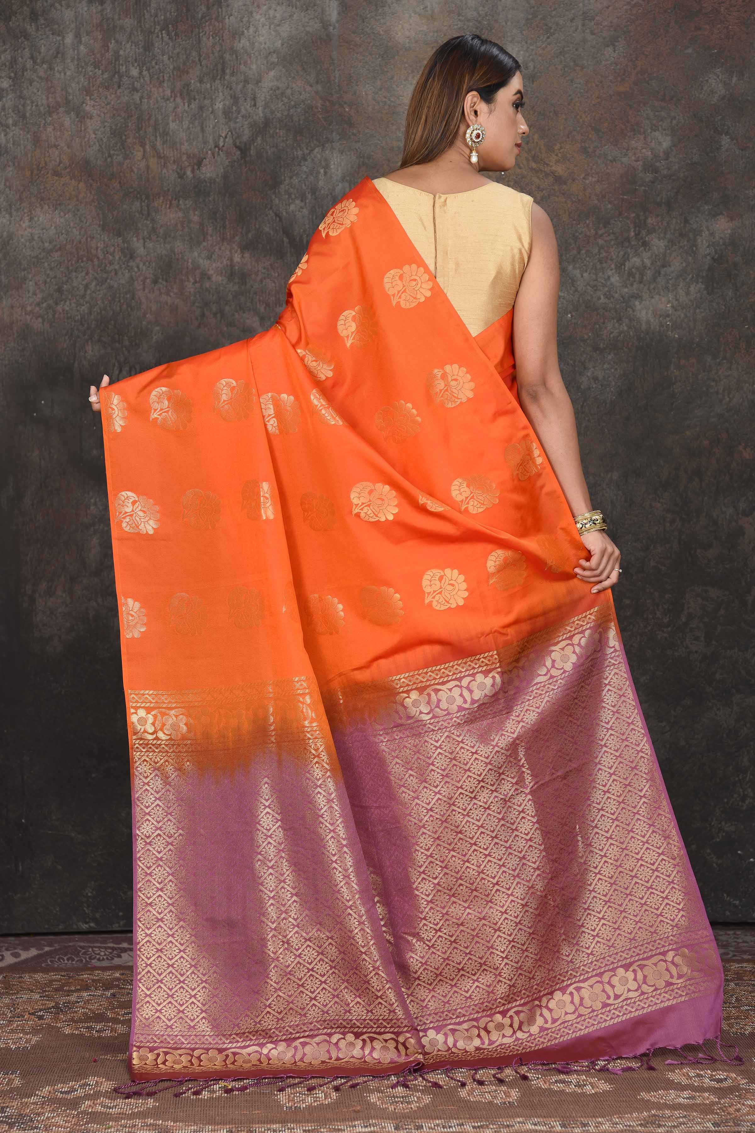 Buy stunning orange Kanjivaram soft silk sari online in USA with purple zari border. Be the center of attraction on special occasions in ethnic sarees, designer sarees, embroidered sarees, handwoven sarees, pure silk sarees from Pure Elegance Indian saree store in USA.-back